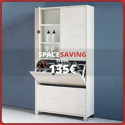  Modern space-saving cabinet in light wood with storage compartments and a tilting shoe drawer, placed against a blue wall. Text: “Space-saving units from €135”.
