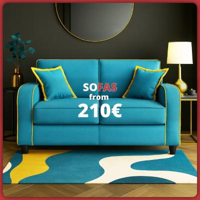 Modern turquoise sofa with yellow piping, matching cushions and a colorful rug in a contemporary living room. Text: “Sofas from €210”.