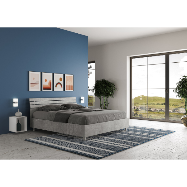 Ankel bed with inclined cement slatted headboard